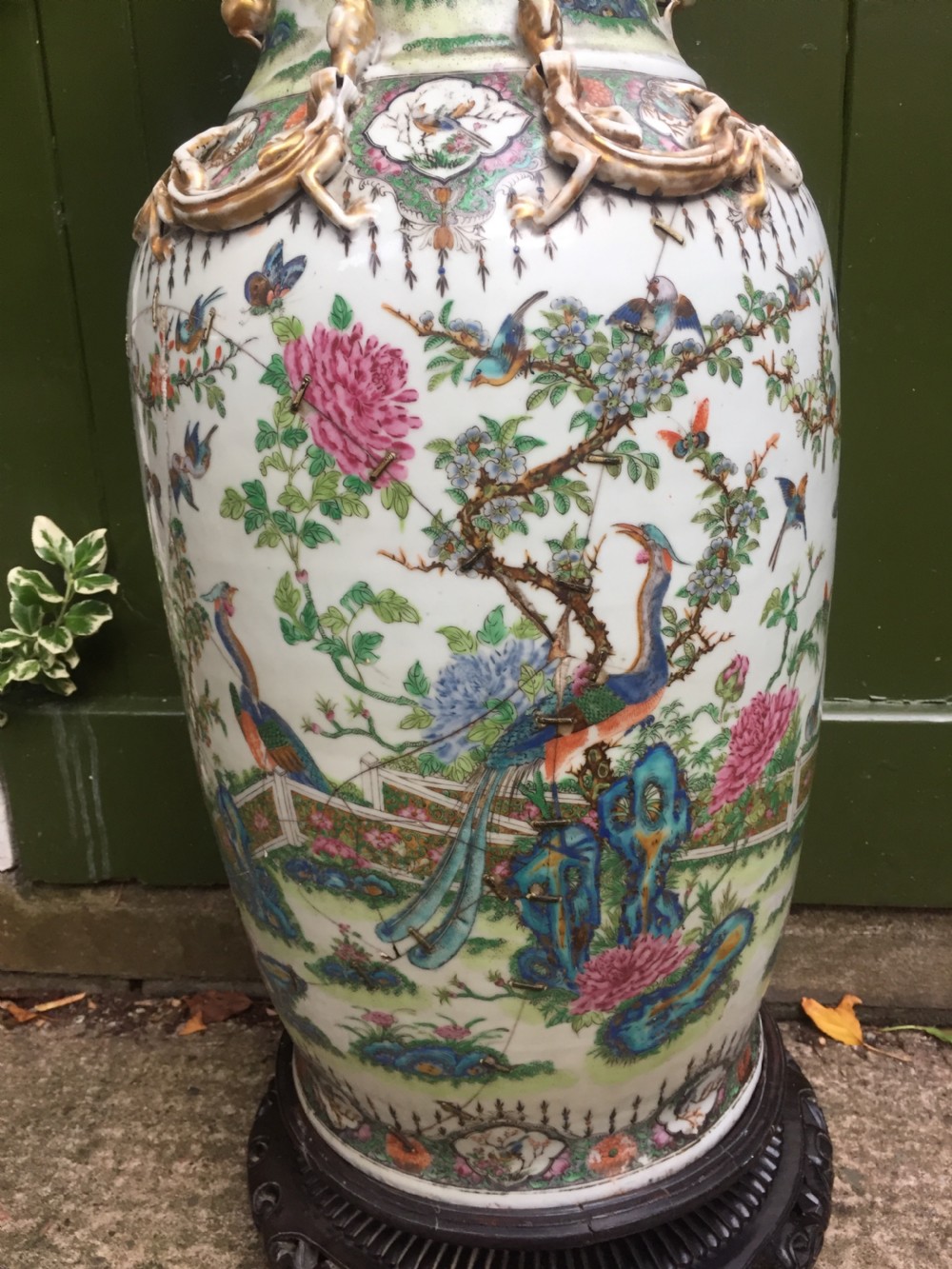 Large scale C19th Chinese Cantonese porcelain enamel decorated vase on hardwood stand in repaired 'country house' condition . View V