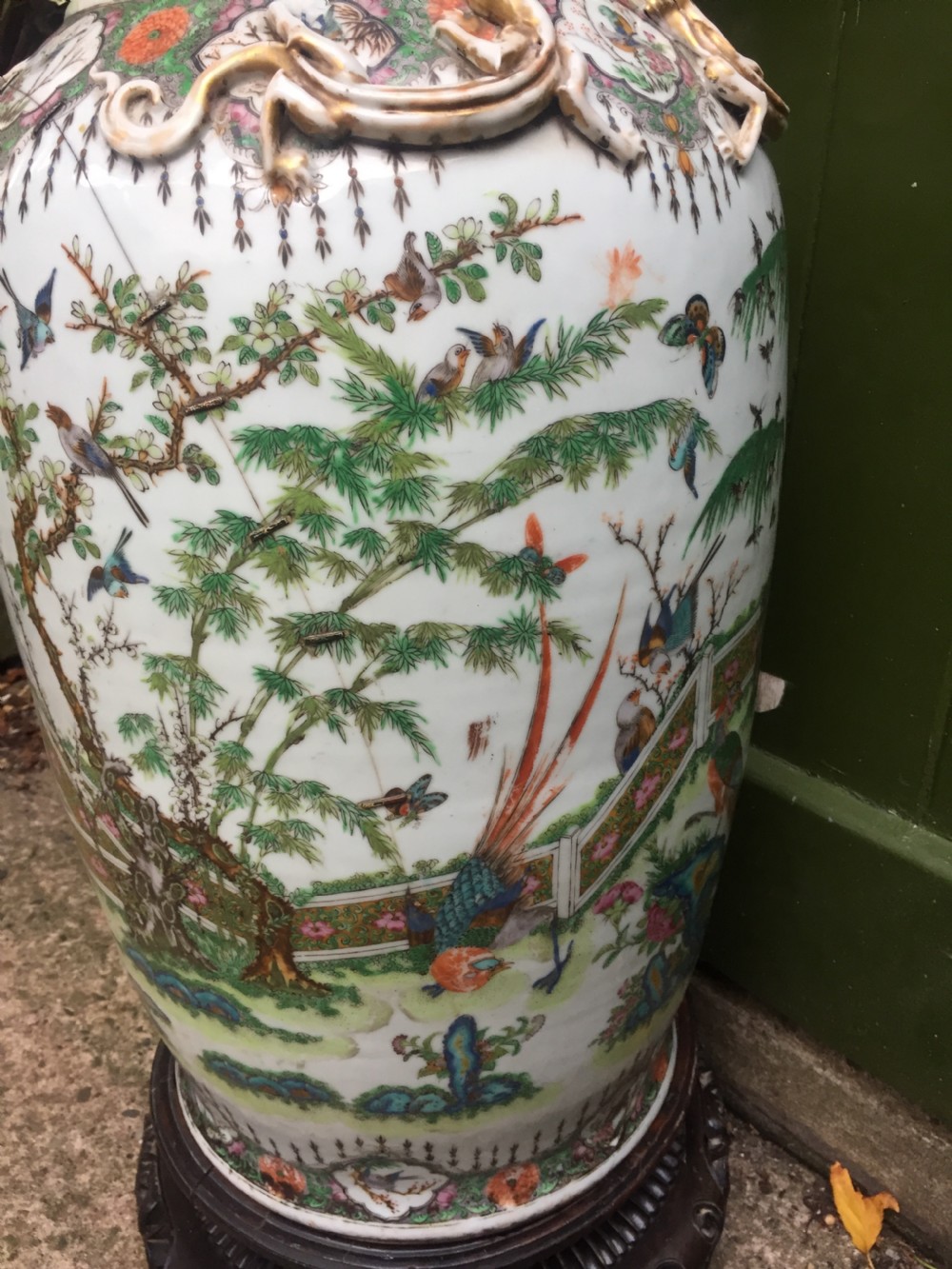 Large scale C19th Chinese Cantonese porcelain enamel decorated vase on hardwood stand in repaired 'country house' condition . View IX