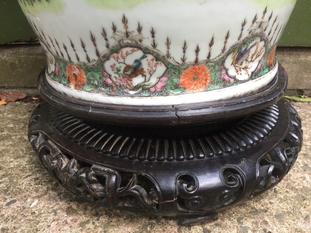 Large scale C19th Chinese Cantonese porcelain enamel decorated vase on hardwood stand in repaired 'country house' condition . View XII