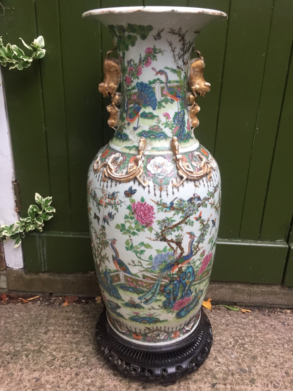 Large scale C19th Chinese Cantonese porcelain enamel decorated vase on hardwood stand in repaired 'country house' condition . View XVII