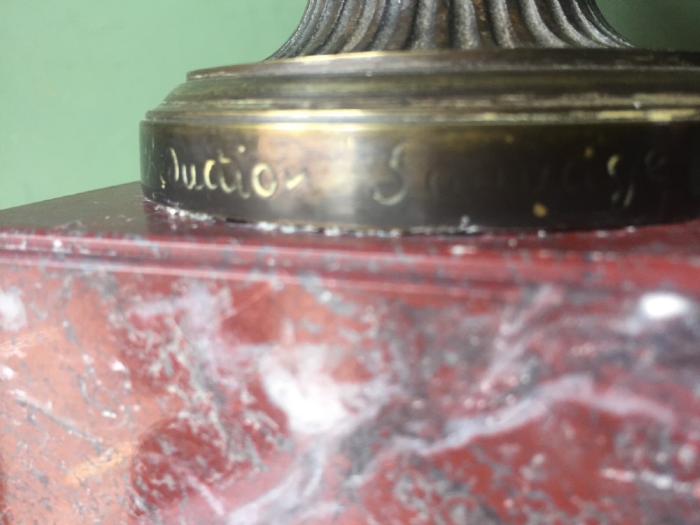 A nineteenth-century dark bronze reduction of the Warwick Vase with Bacchanalian masks and vine handles, mounted on a red marble square base. View IX