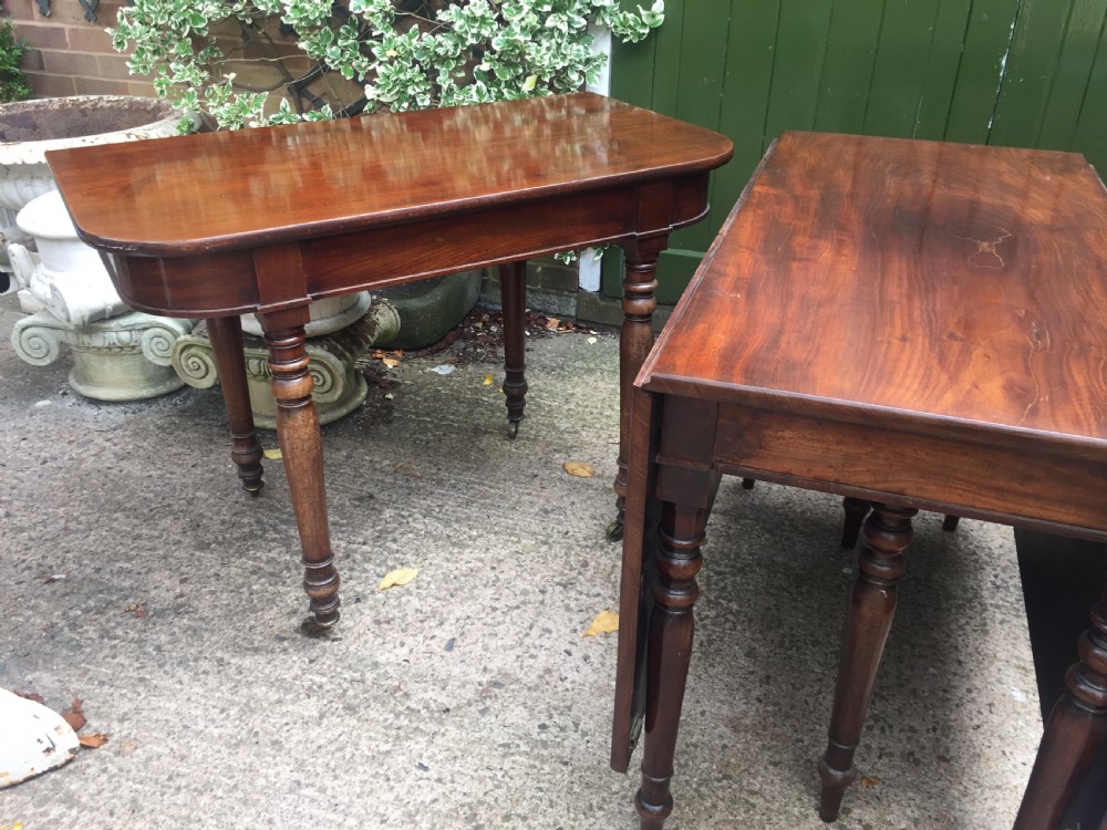 A Regency mahogany extending dining table with turned legs and brass castors. View XV