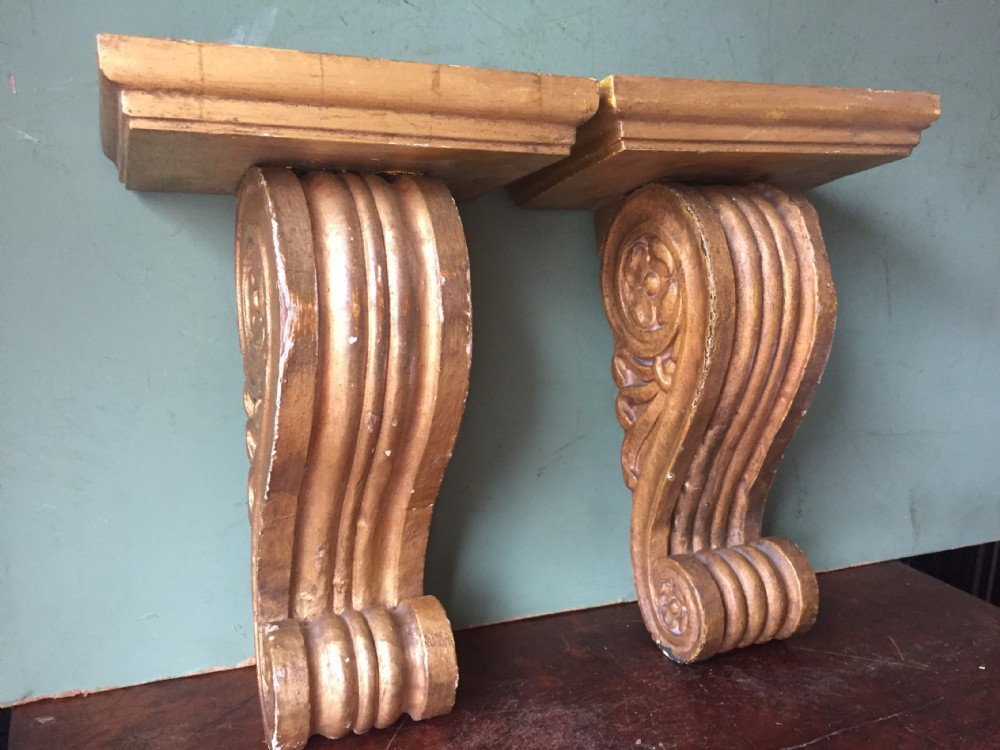 Useful pair of decorative mid C19th giltwood corbel display brackets of classical design. View IX