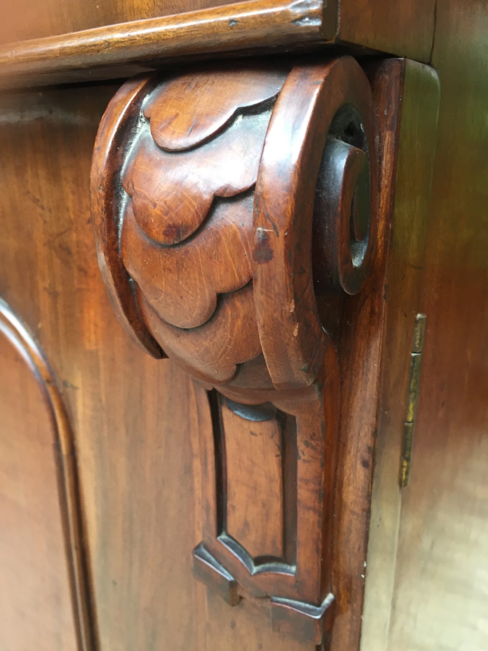 A mid nineteenth-century mahogany library bookcase featuring twin glazed doors over a two-door solid timber cupboard base. View VII