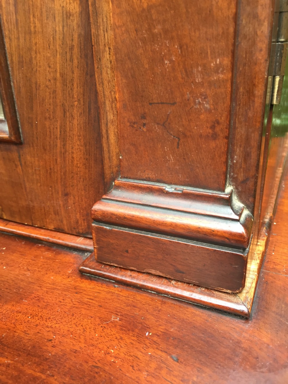 A mid nineteenth-century mahogany library bookcase featuring twin glazed doors over a two-door solid timber cupboard base. View VIII