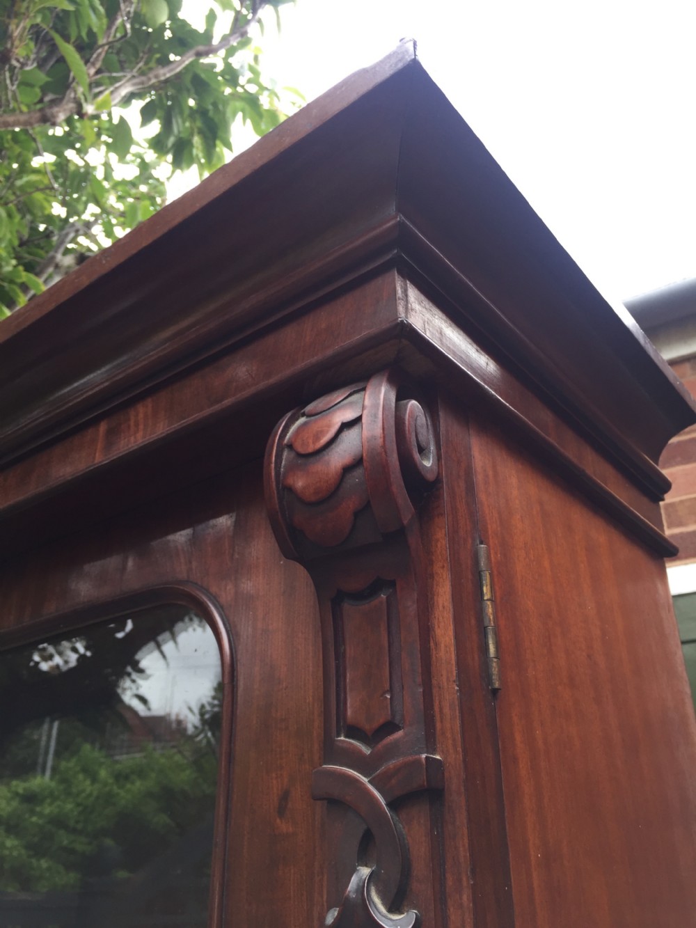 A mid nineteenth-century mahogany library bookcase featuring twin glazed doors over a two-door solid timber cupboard base. View IX