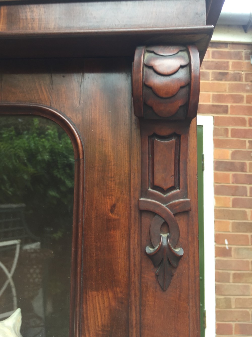 A mid nineteenth-century mahogany library bookcase featuring twin glazed doors over a two-door solid timber cupboard base. View XII