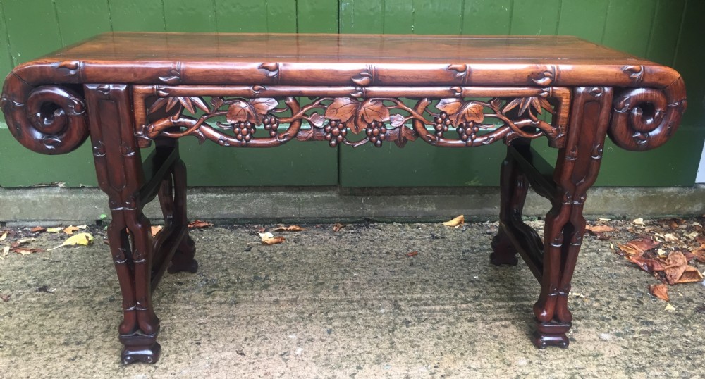 Superior quality late C19th Chinese Qing Dynasty carved hardwood 'kang' table in the form of a miniature altar table .