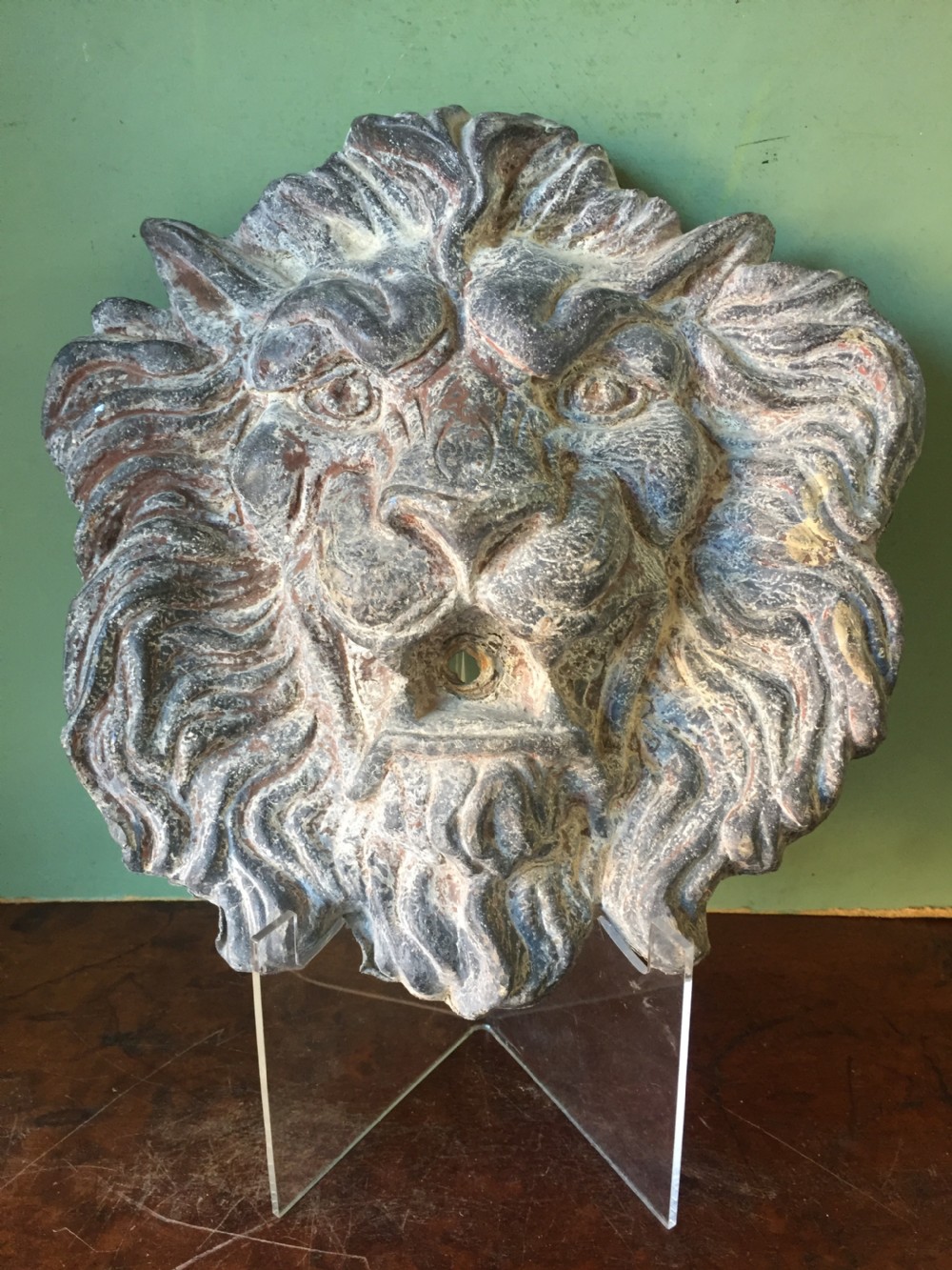 Well cast and patinated mid C19th lead lion's-mask wall-fountain head .