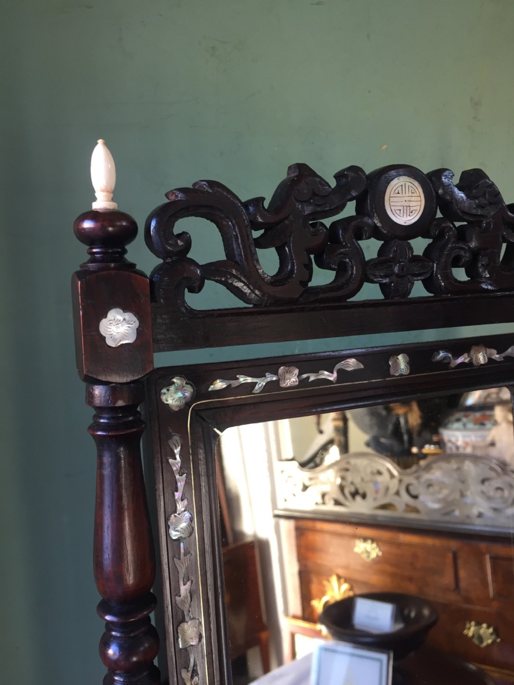Interesting mid C19th Chinese miniature hardwood-framed vanity mirror with 'mother of pearl' inlay and ivory finials. View II