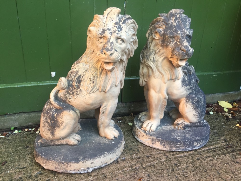 Fine and decorative pair of C19th weathered terracotta sitting lions in the C18th anthropomorphic taste. View III