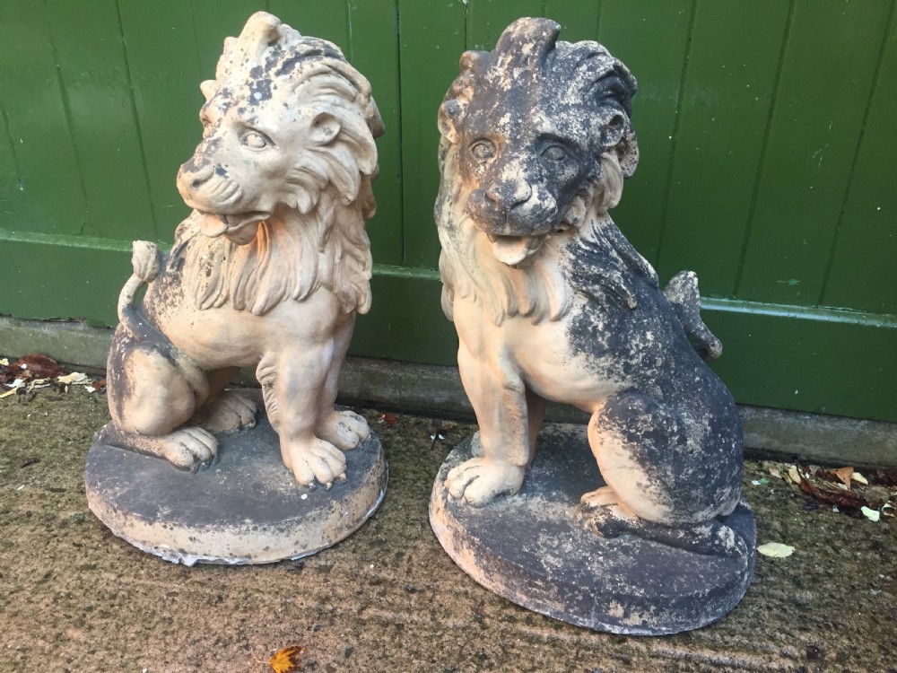 Fine and decorative pair of C19th weathered terracotta sitting lions in the C18th anthropomorphic taste. View IV