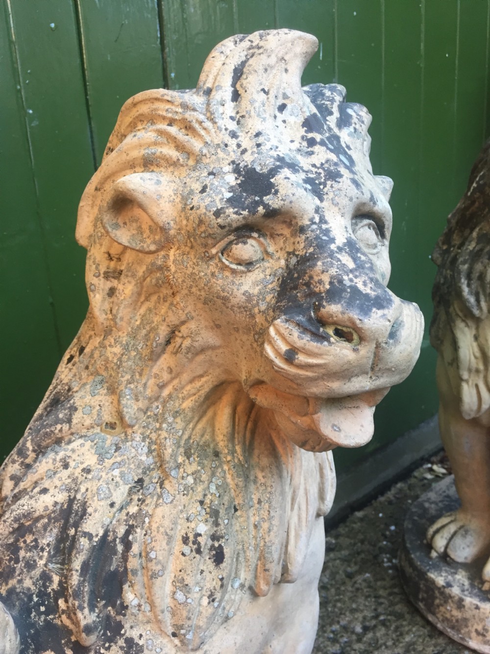 Fine and decorative pair of C19th weathered terracotta sitting lions in the C18th anthropomorphic taste. View VII