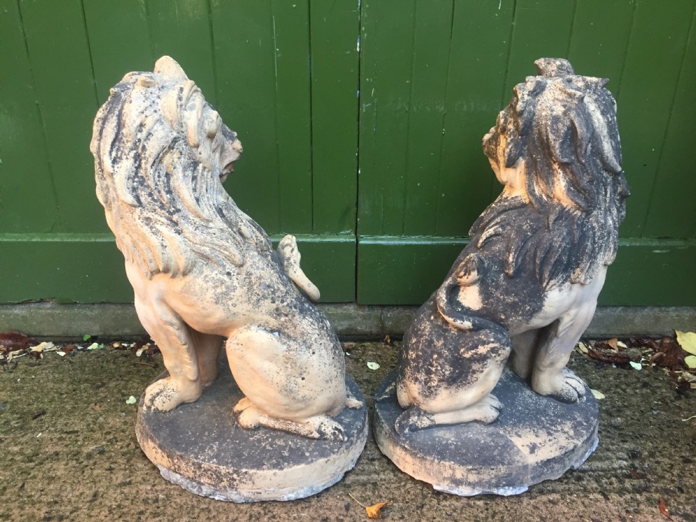 Fine and decorative pair of C19th weathered terracotta sitting lions in the C18th anthropomorphic taste. View X