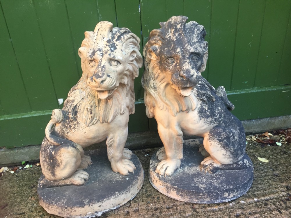 Fine and decorative pair of C19th weathered terracotta sitting lions in the C18th anthropomorphic taste. View XII