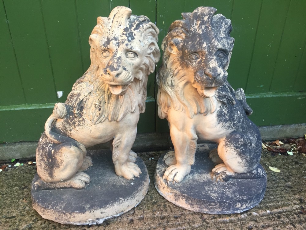 Fine and decorative pair of C19th weathered terracotta sitting lions in the C18th anthropomorphic taste. View XVI