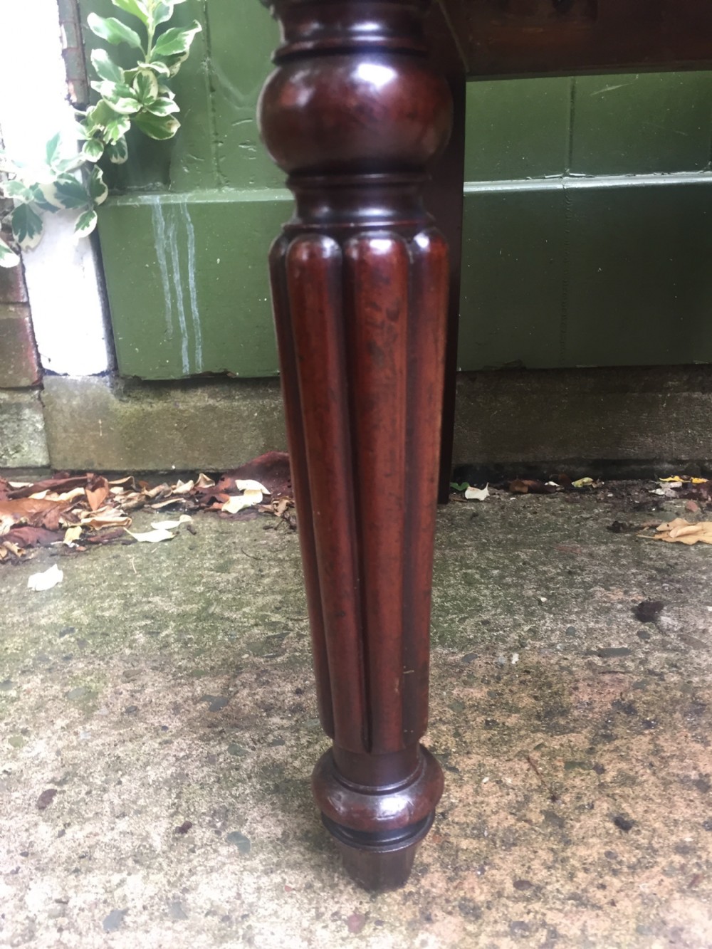 A set of six early nineteenth-century George IV mahogany dining chairs featuring carved balloon back frames, reeded legs, and red pattern upholstered seats. View XVI