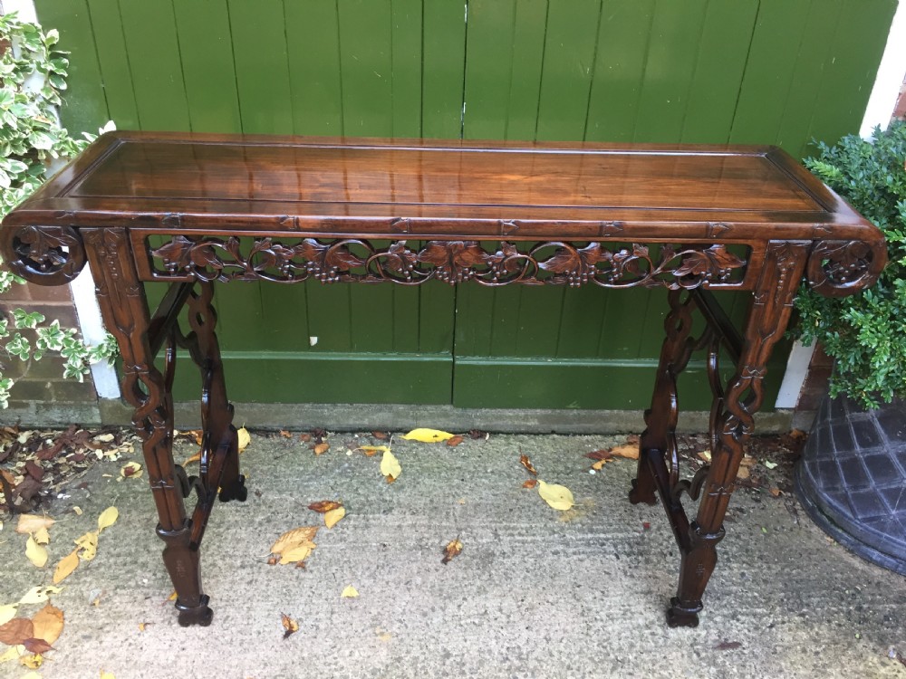 Fine quality late C19th Chinese Qing Dynasty carved hardwood scroll-ended 'altar' or console table of elegant proportions. View II
