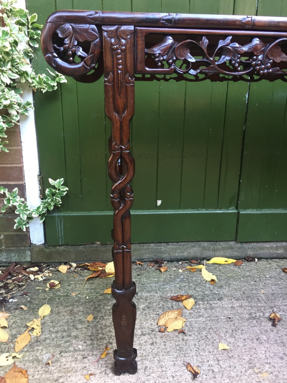 Fine quality late C19th Chinese Qing Dynasty carved hardwood scroll-ended 'altar' or console table of elegant proportions. View IV