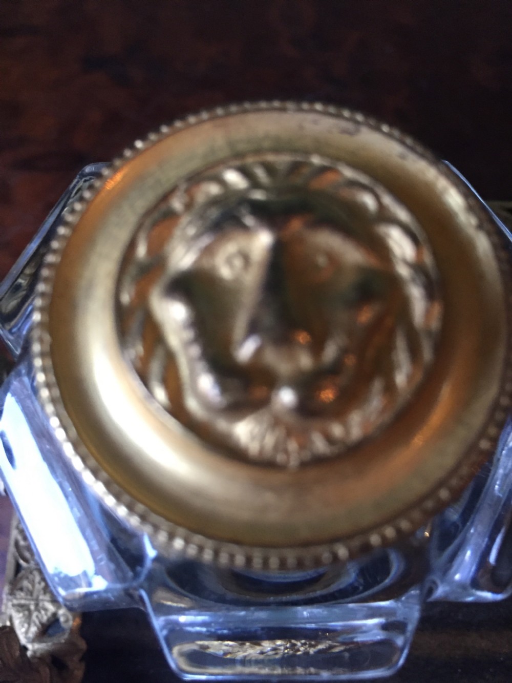 An early nineteenth-century French Empire style ormolu inkstand featuring two cut-crystal inkwells, a central holder, foliate handles, and a decorative gilt bronze tray. View V