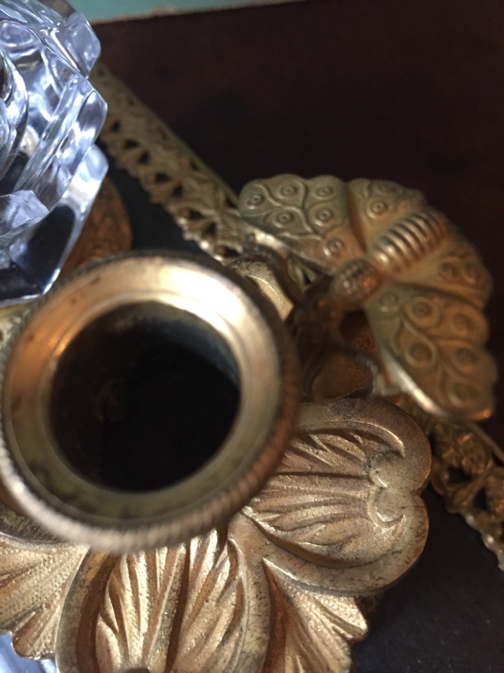 An early nineteenth-century French Empire style ormolu inkstand featuring two cut-crystal inkwells, a central holder, foliate handles, and a decorative gilt bronze tray. View VII