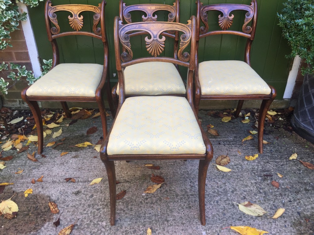 A set of four early nineteenth-century Regency Greek Revival side chairs with carved anthemion backrests and yellow upholstered seats. View XIV