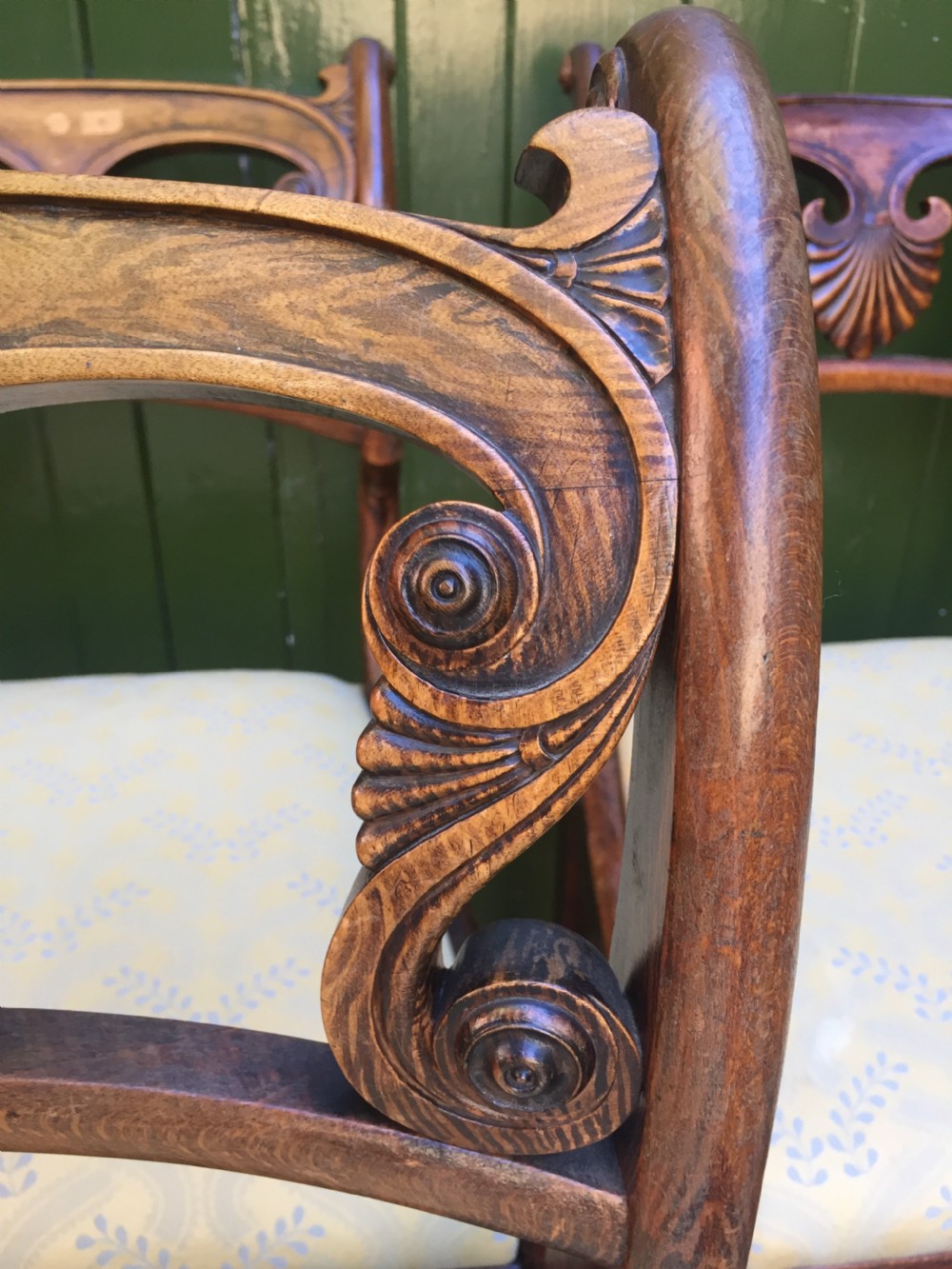 A set of four early nineteenth-century Regency Greek Revival side chairs with carved anthemion backrests and yellow upholstered seats. View XVI