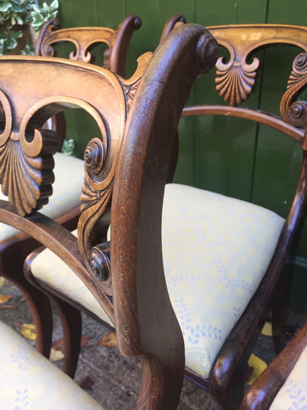 A set of four early nineteenth-century Regency Greek Revival side chairs with carved anthemion backrests and yellow upholstered seats. View XVIII