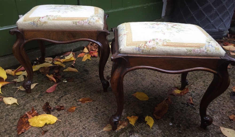 Pair of mid C19th Victorian period carved and figured rosewood-framed stools with needlework seats. View III