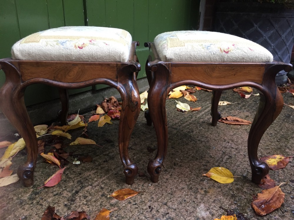 Pair of mid C19th Victorian period carved and figured rosewood-framed stools with needlework seats. View IV