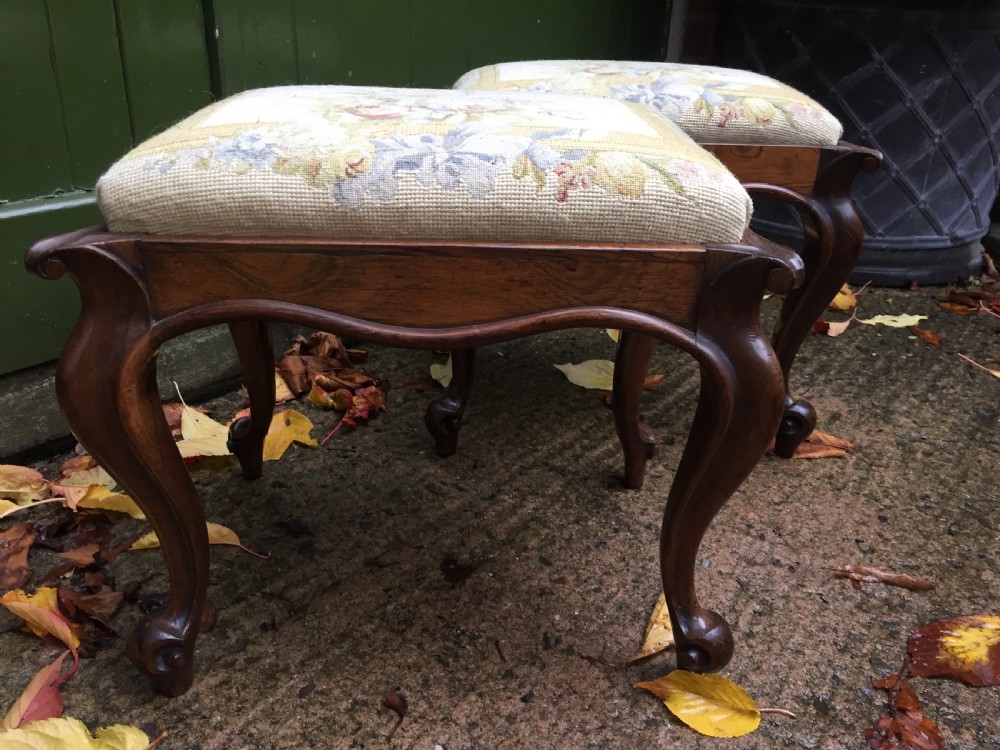 Pair of mid C19th Victorian period carved and figured rosewood-framed stools with needlework seats. View XII