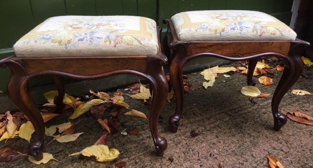Pair of mid C19th Victorian period carved and figured rosewood-framed stools with needlework seats. View XIV