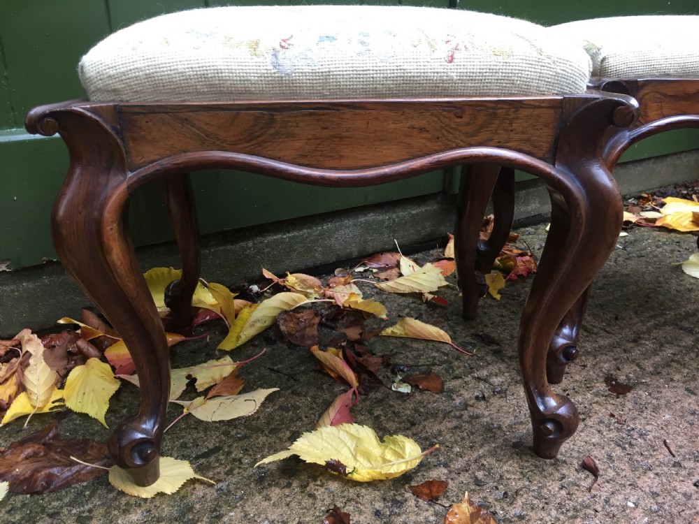 Pair of mid C19th Victorian period carved and figured rosewood-framed stools with needlework seats. View XV