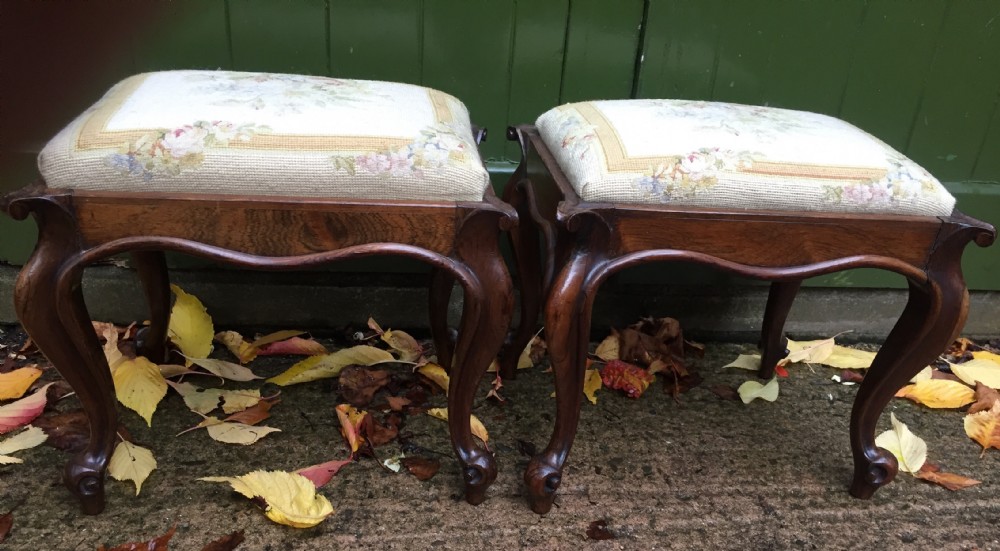 Pair of mid C19th Victorian period carved and figured rosewood-framed stools with needlework seats. View VIII