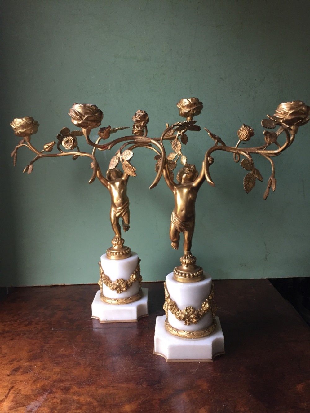 Smart quality pair of French late C19th ormolu bronze and white marble cherub candelabras. View II