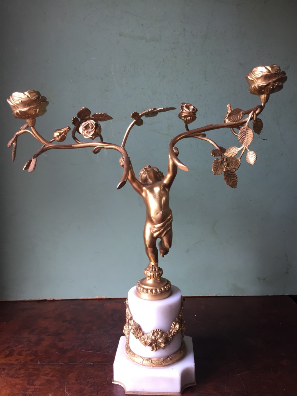 Smart quality pair of French late C19th ormolu bronze and white marble cherub candelabras. View IV