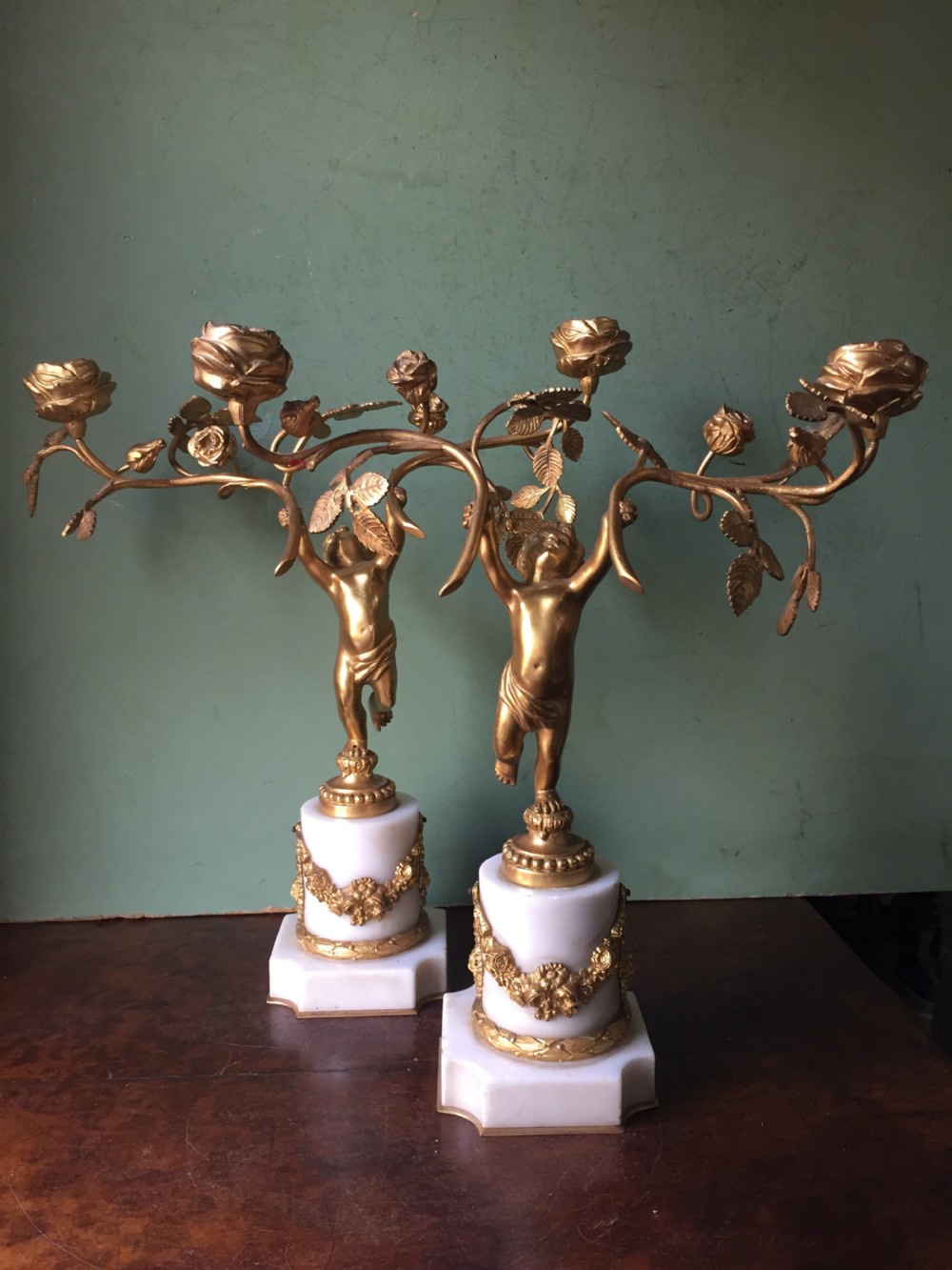 Smart quality pair of French late C19th ormolu bronze and white marble cherub candelabras. View XV