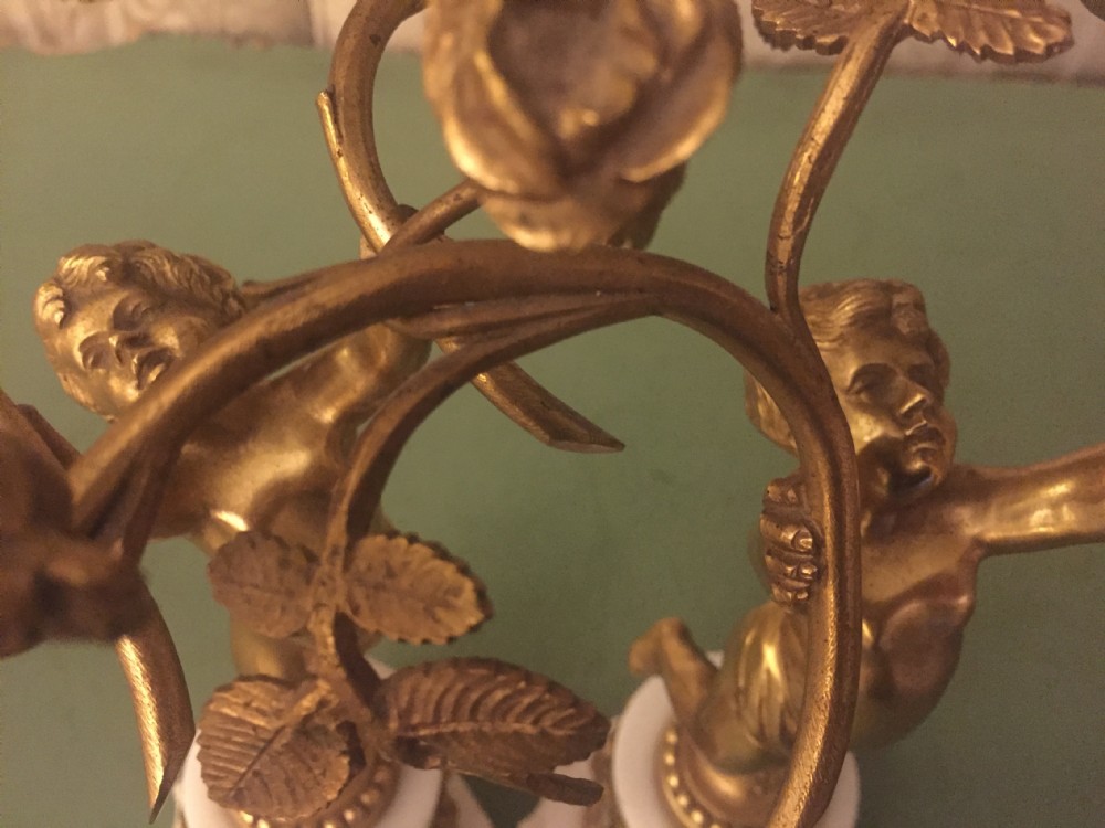 Smart quality pair of French late C19th ormolu bronze and white marble cherub candelabras. View XVIII