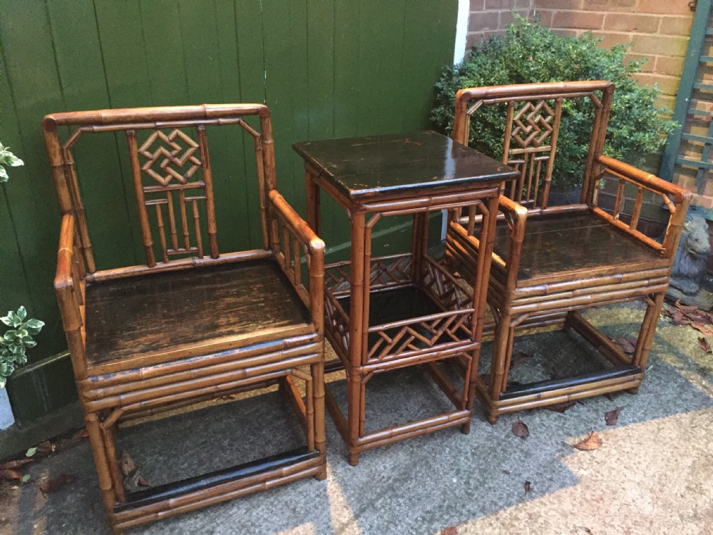 Decorative pair of early C20th Chinese polished bamboo and lacquer armchairs and table in the C18th manner  . View IV