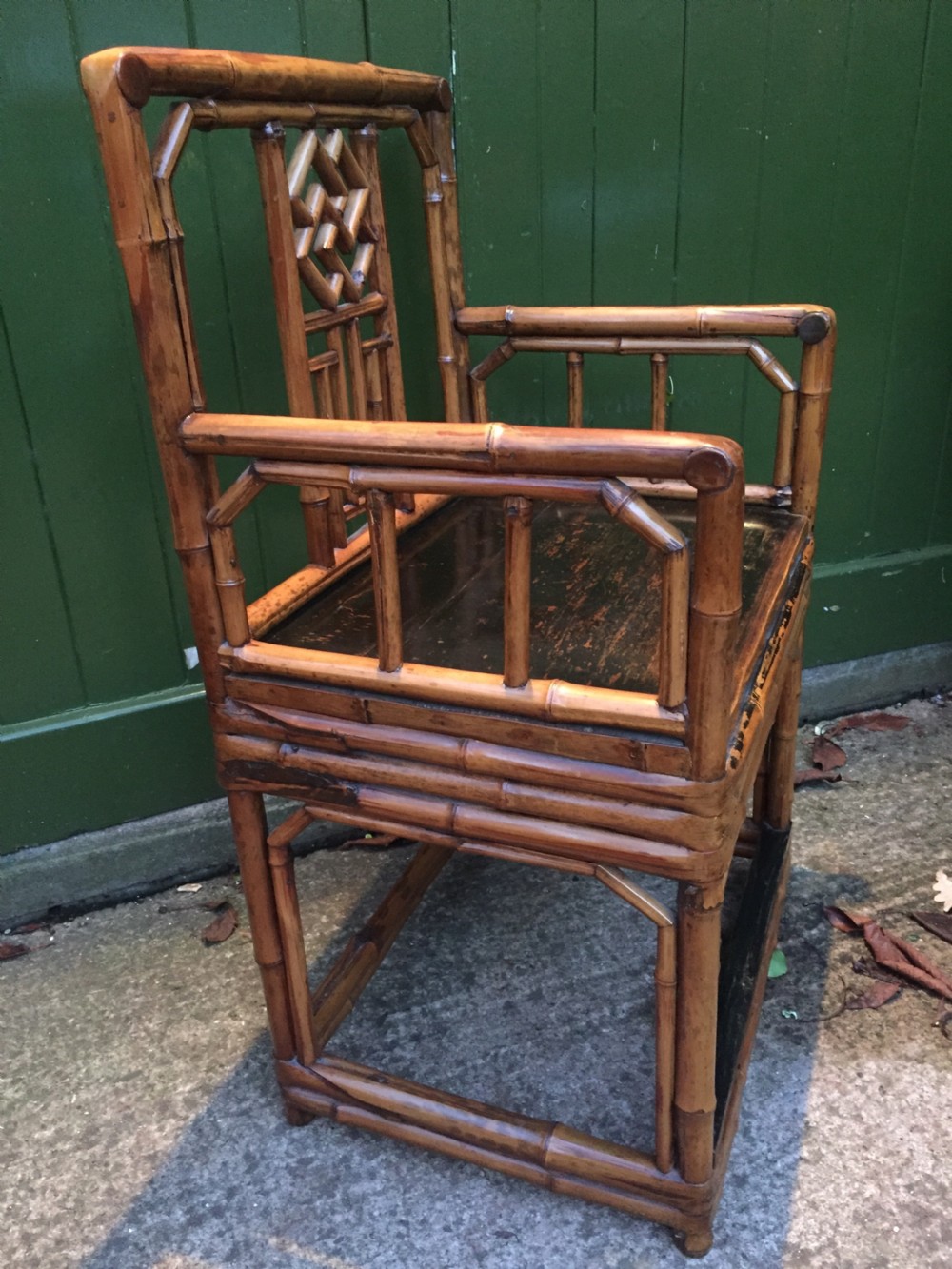 Decorative pair of early C20th Chinese polished bamboo and lacquer armchairs and table in the C18th manner  . View VII