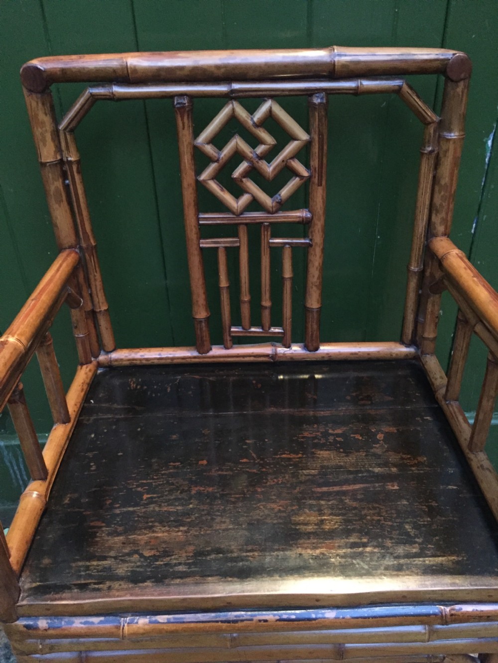 Decorative pair of early C20th Chinese polished bamboo and lacquer armchairs and table in the C18th manner  . View VIII