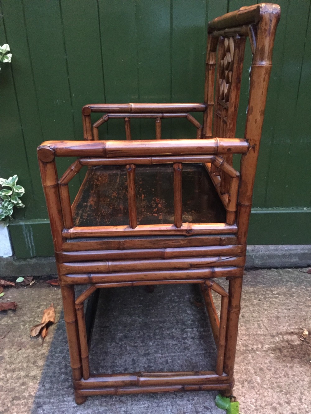 Decorative pair of early C20th Chinese polished bamboo and lacquer armchairs and table in the C18th manner  . View X