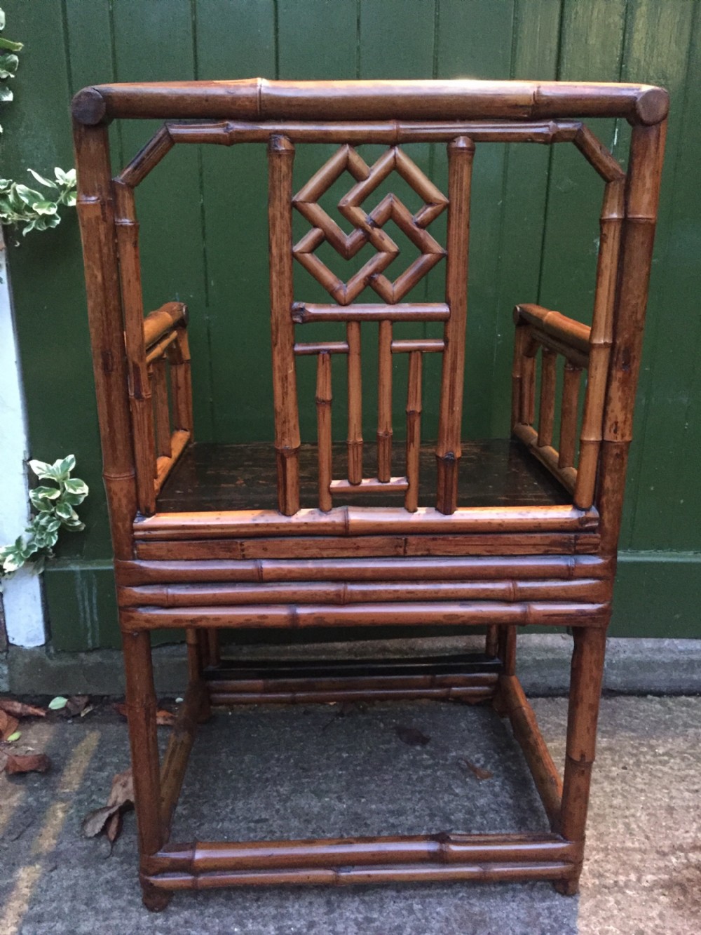 Decorative pair of early C20th Chinese polished bamboo and lacquer armchairs and table in the C18th manner  . View XI