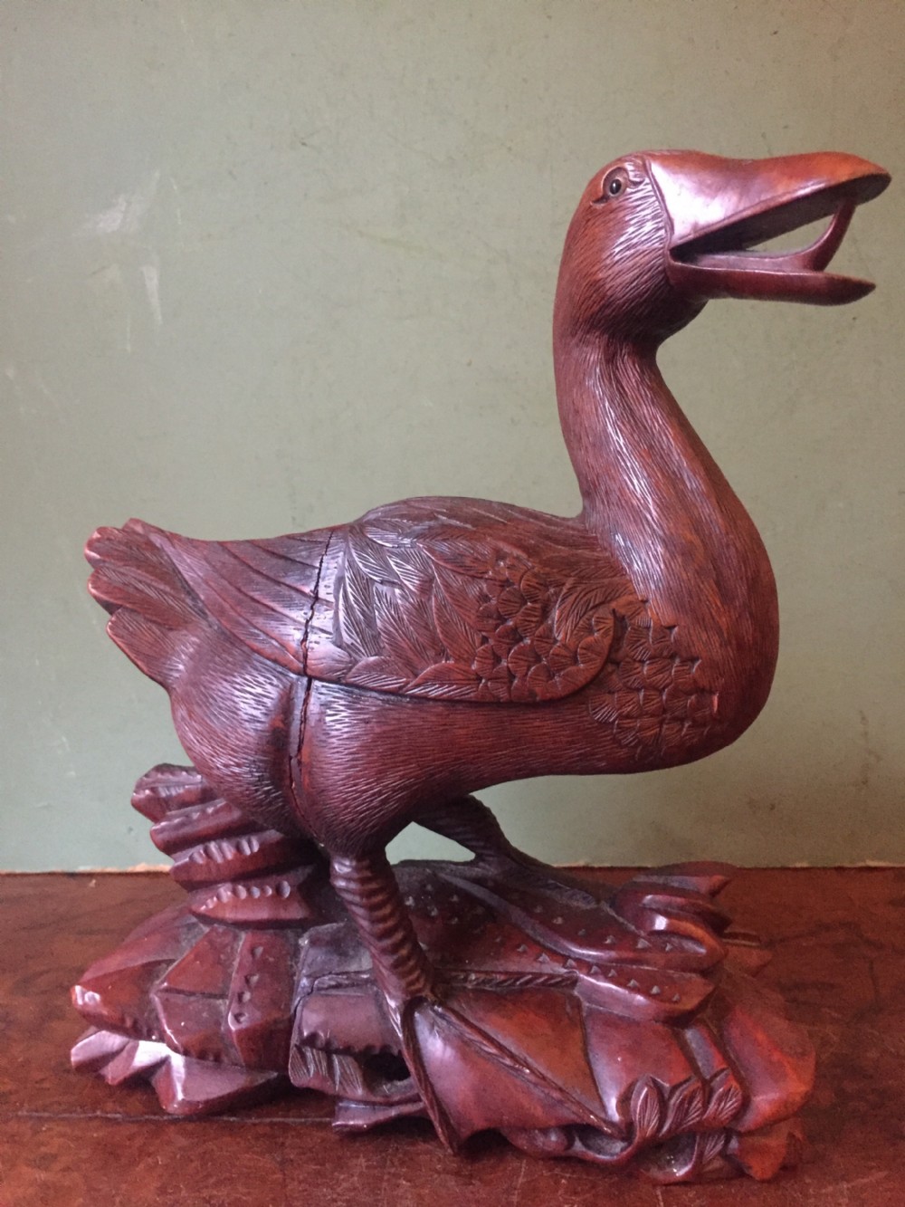 A pair of late nineteenth-century Chinese hardwood carved ducks with open beaks resting on sculpted bases. View VI