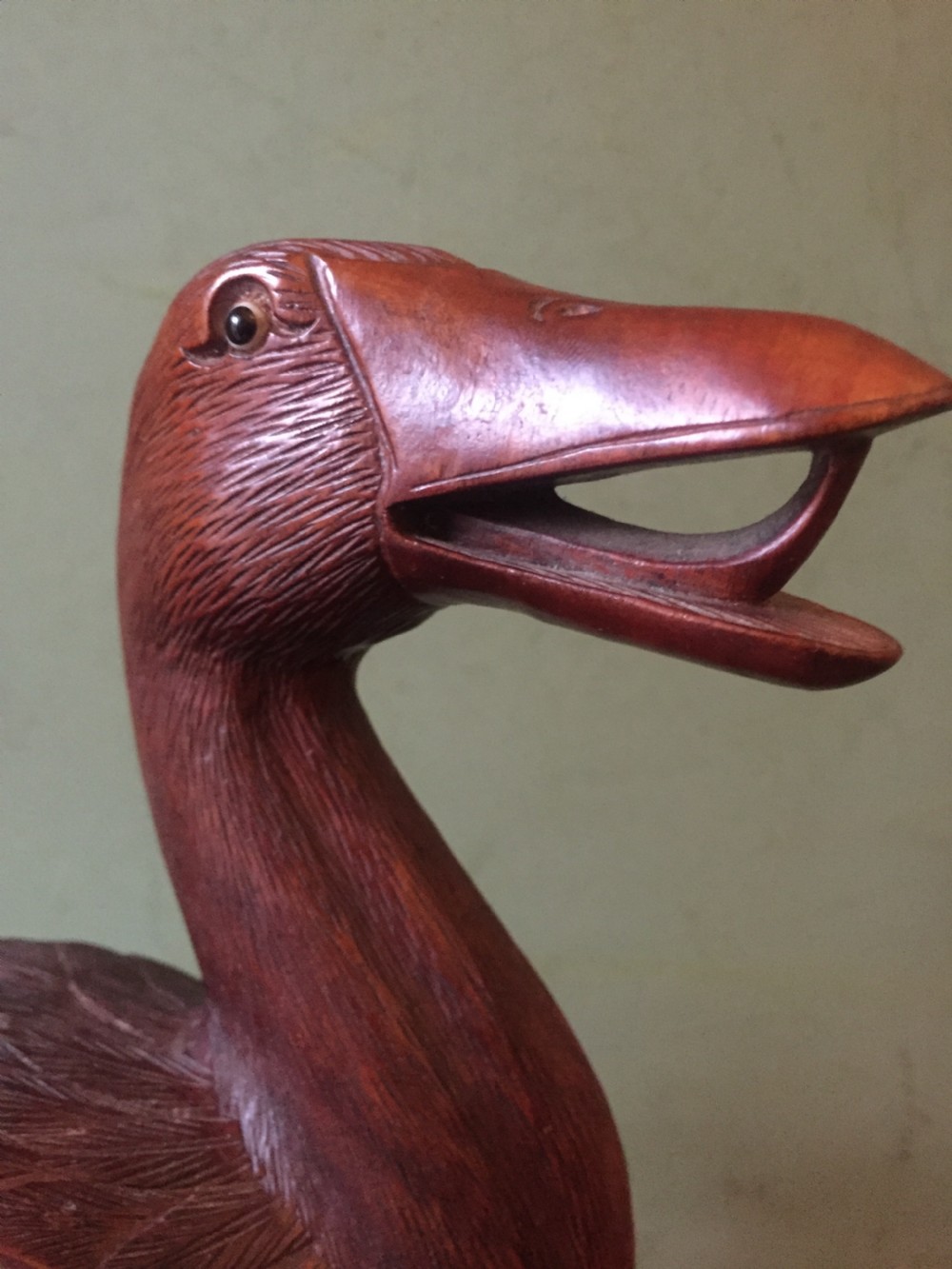 A pair of late nineteenth-century Chinese hardwood carved ducks with open beaks resting on sculpted bases. View IX