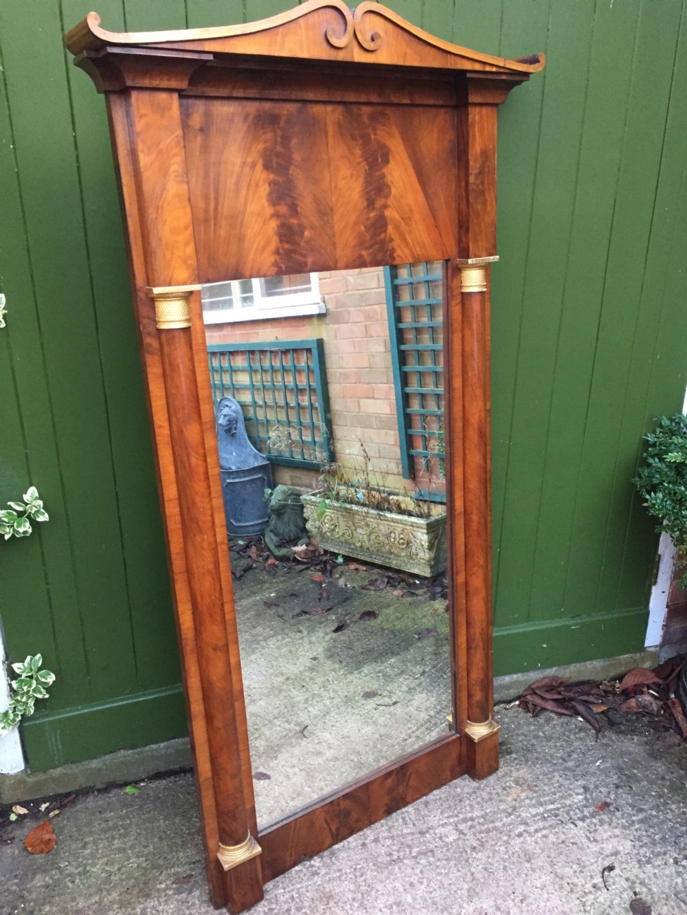 Early C19th Baltic region mahogany framed pier mirror with parcel-gilt column caps and bases . View II