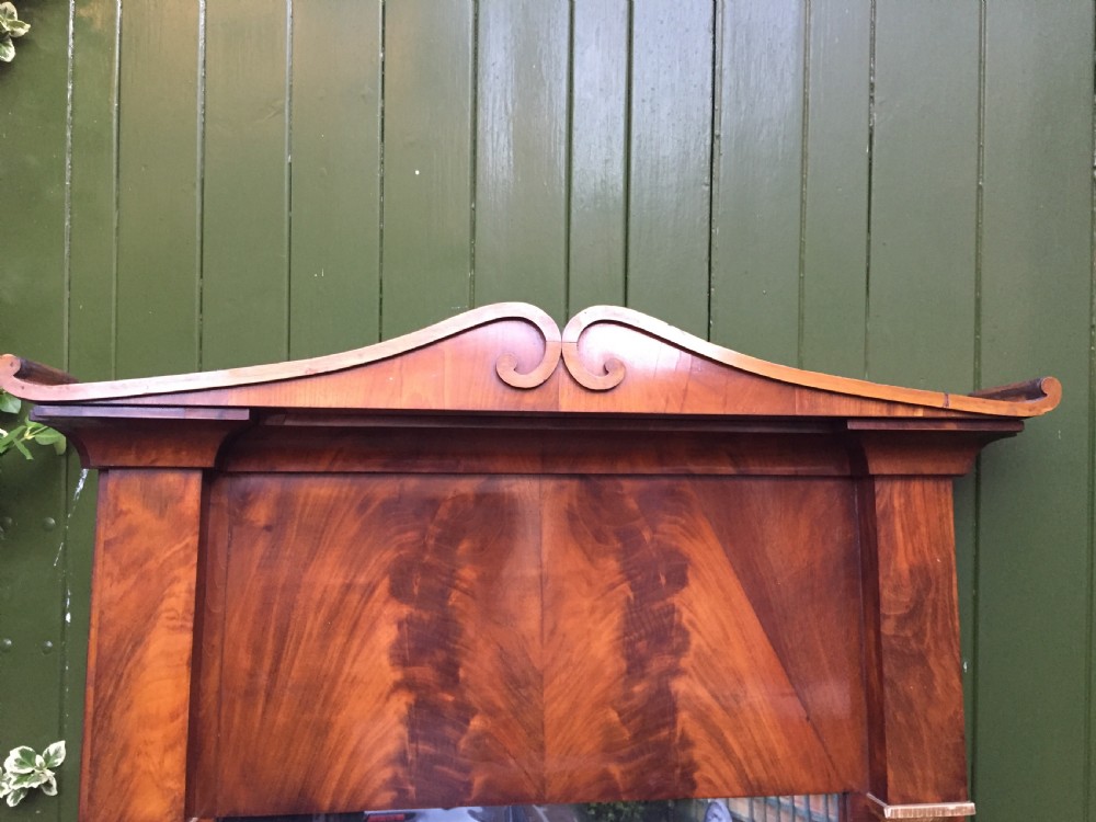 Early C19th Baltic region mahogany framed pier mirror with parcel-gilt column caps and bases . View VI