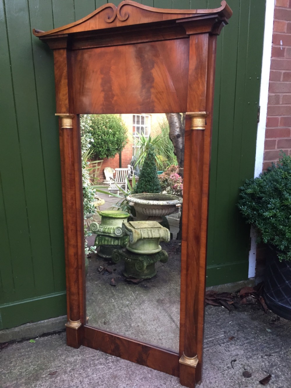Early C19th Baltic region mahogany framed pier mirror with parcel-gilt column caps and bases . View X