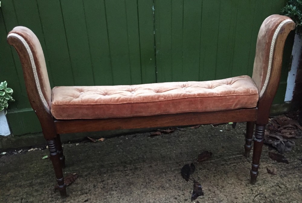 An elegant early C19th Regency mahogany-framed window-seat of unusual form. View IV