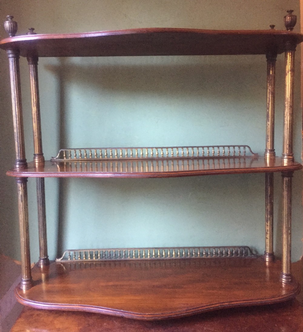 Set of late C19th walnut and brass-mounted shelves in the manner of James Shoolbred & Co., London.